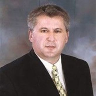 Dr. John Nomikos